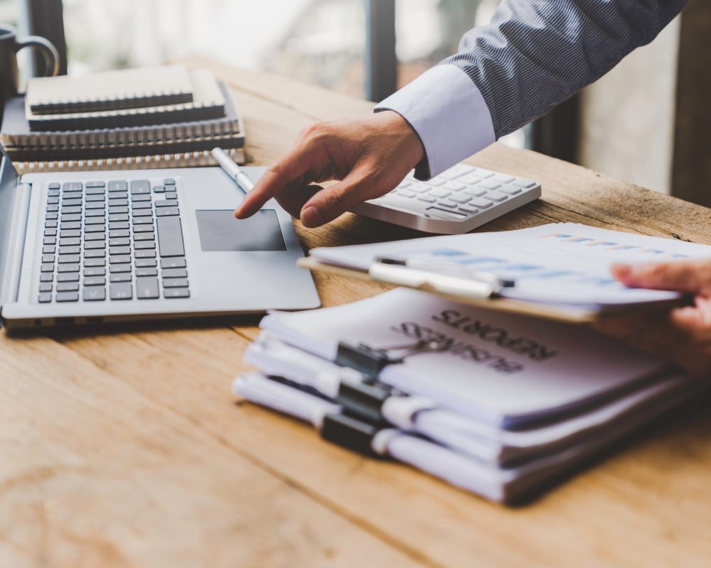businessman putting documents on the table Gather documents from the meeting business reports, impor