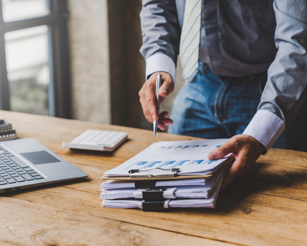 businessman putting documents on the table Gather documents from the meeting business reports, impor
